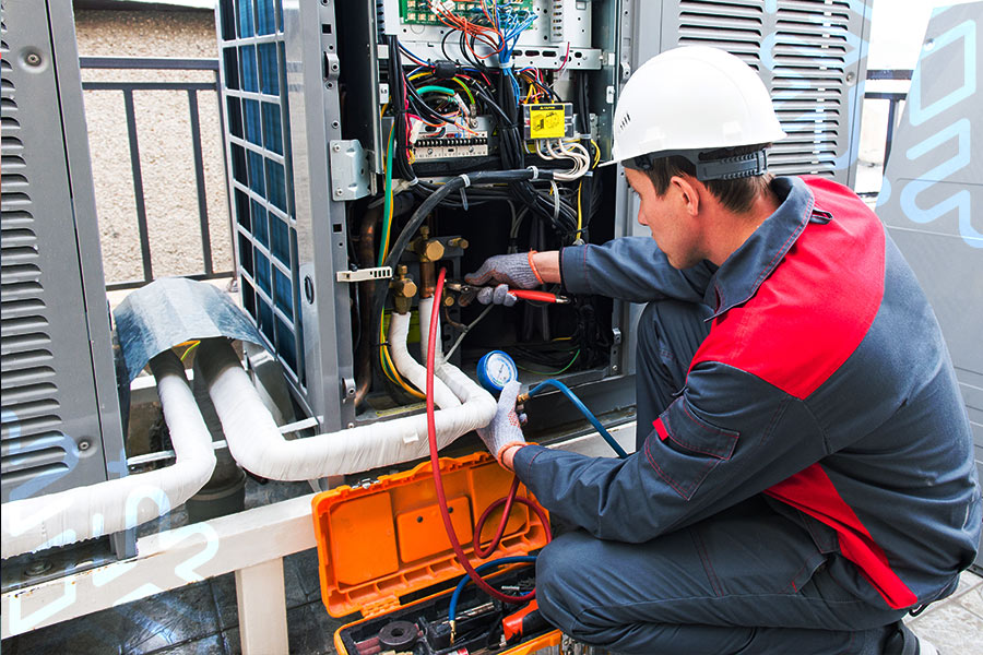 technician checking air conditioner