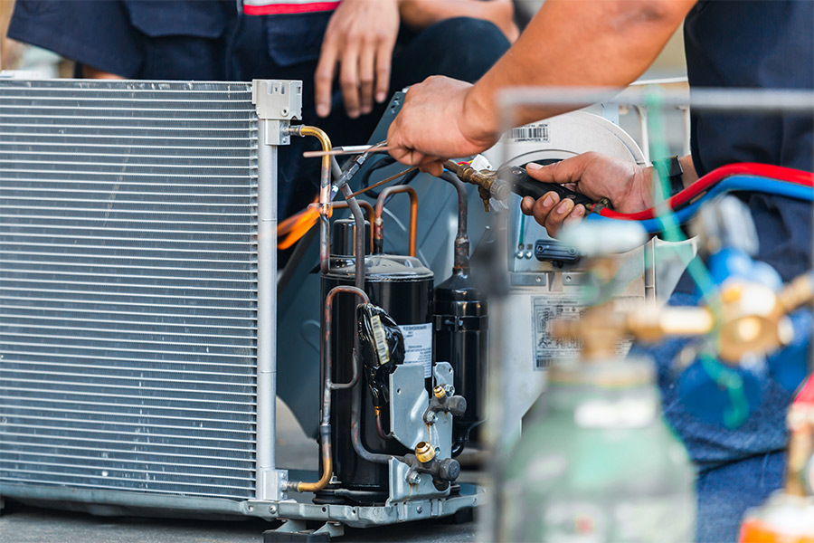 group of contractors repairing hvac unit close up highlands tx