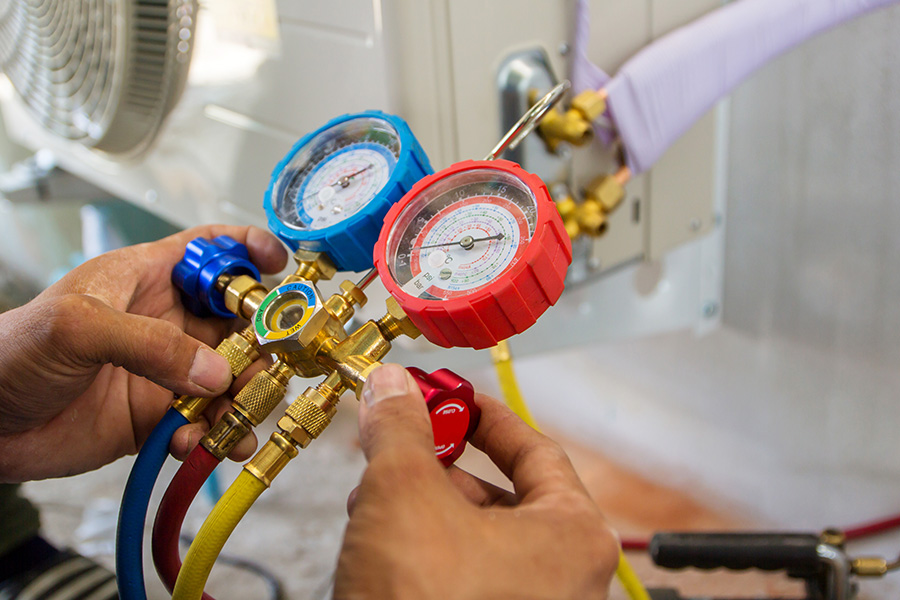 technician hands close up with tool doing maintenance at hvac system barrett tx